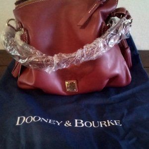 Dooney and Bourke Tegan leather shoulder bag with accessories and dust cover. Ne